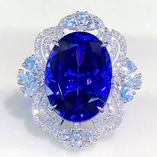 14k Gold 13.36 Ctw Natural Tanzanite & Aquamarine Ring: Ref:231001005 // gold content:14k gold // ring size:7. 25us // // main gemstone:tanzanite // shape:oval // carat weight:12. 61ct // color:blue // treatment:natural // // adjacent gemstone 2 :