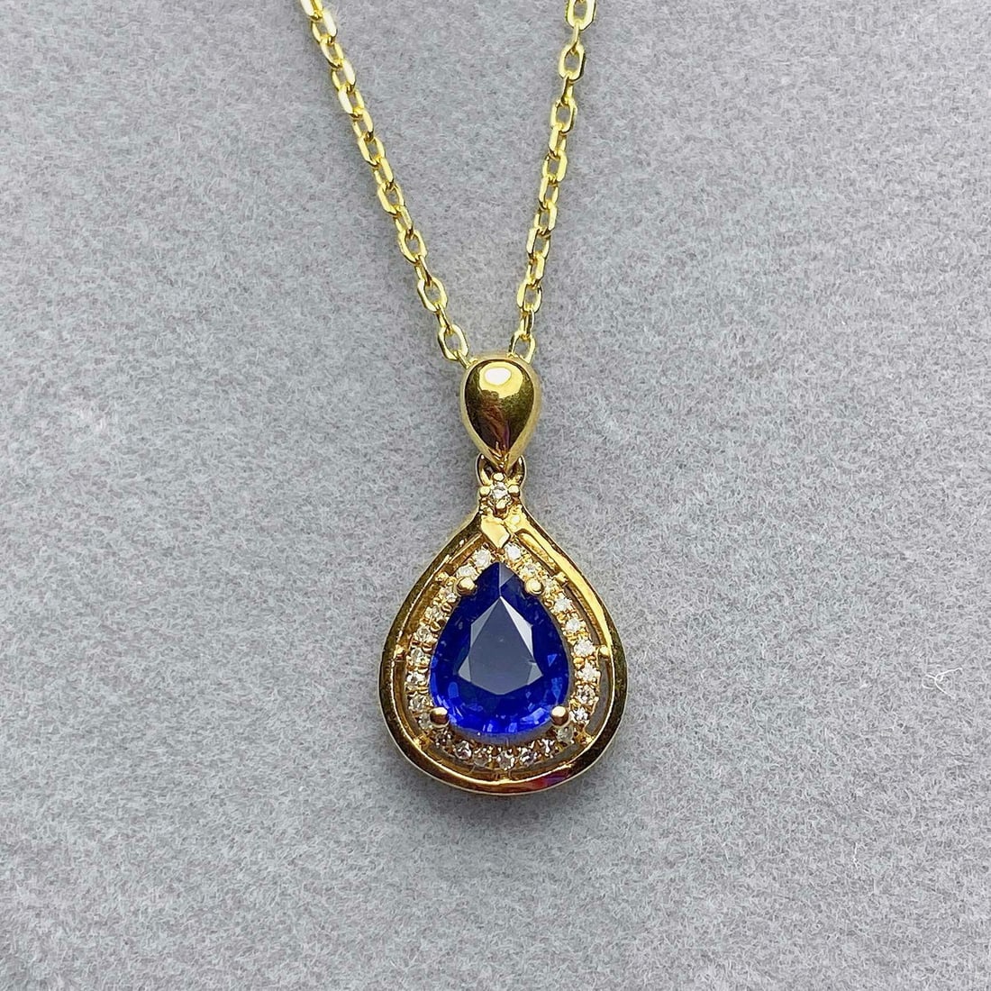 14k Gold 1.05 Ct Natural Sapphire & Diamond Pendant( Without Chain ): Ref:231001071 // gold content:14k gold // main gemstone:sapphire // shape:pear // carat weight:1. 05ct // color:blue // treatment:natural // // adjacent gemstone 2 : diamond // number of stones:26 // 