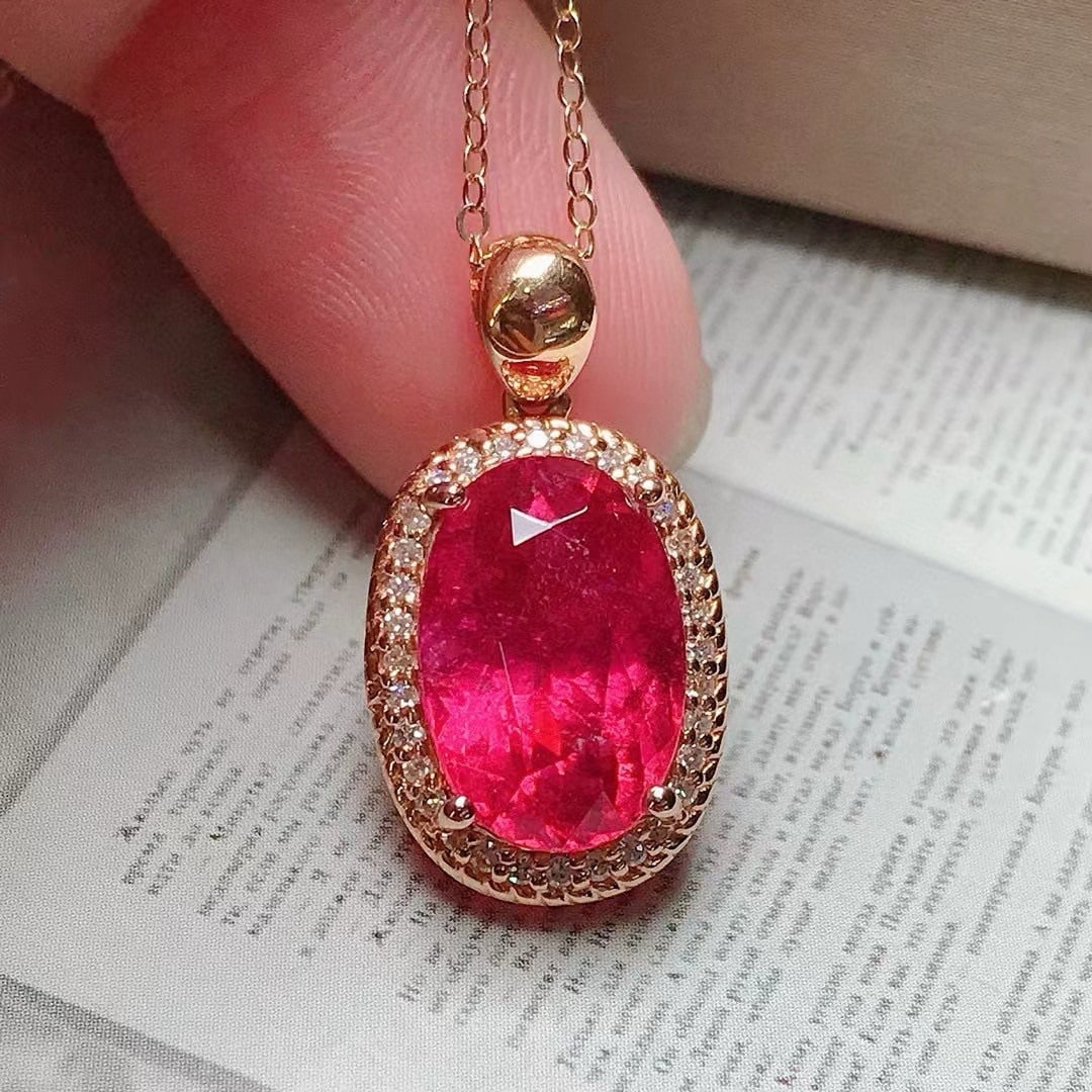 14k Gold 4.4 Ct Natural Tourmaline & Diamond Pendant( Without Chain ): Ref:231001148 // gold content:14k gold // main gemstone:tourmaline // shape:oval // carat weight:4. 4ct // color:red // treatment:natural // // adjacent gemstone 2 : diamond // number of stones:32 //