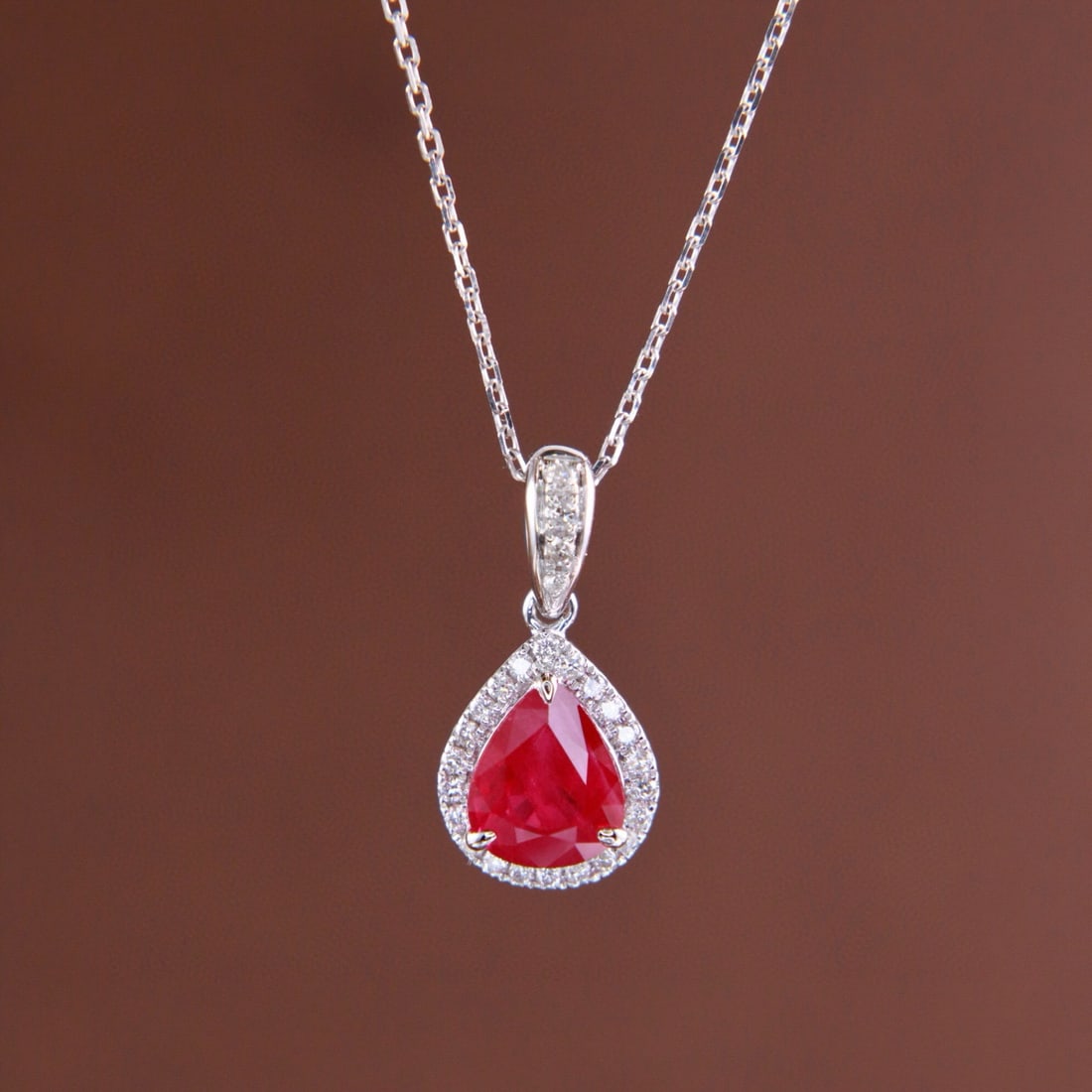 14k Gold 1.24 Ctw Natural Ruby & Diamond Necklace: Ref:231001170 // gold content:14k gold // main gemstone:ruby // shape:pear // carat weight:1. 11ct // color:red // treatment:natural // // adjacent gemstone 2 : diamond // shape:round // carat