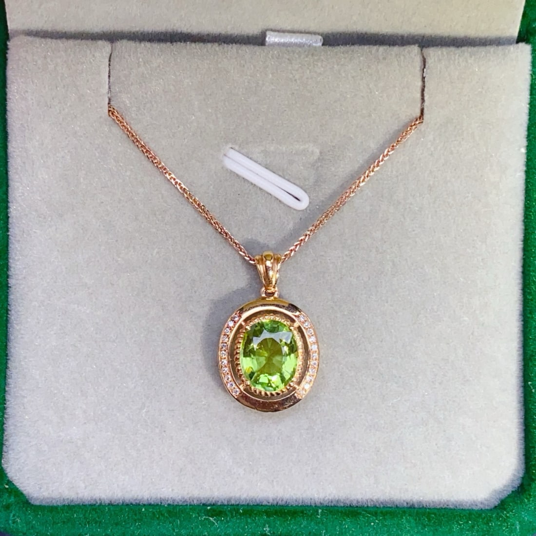 14k Gold 1.81 Ctw Natural Tourmaline & Diamond Pendant( Without Chain ): Ref:231001190 // gold content:14k gold // main gemstone:tourmaline // shape:oval // carat weight:1. 75ct // color:green // treatment:natural // // adjacent gemstone 2 : diamond // number of stones:22