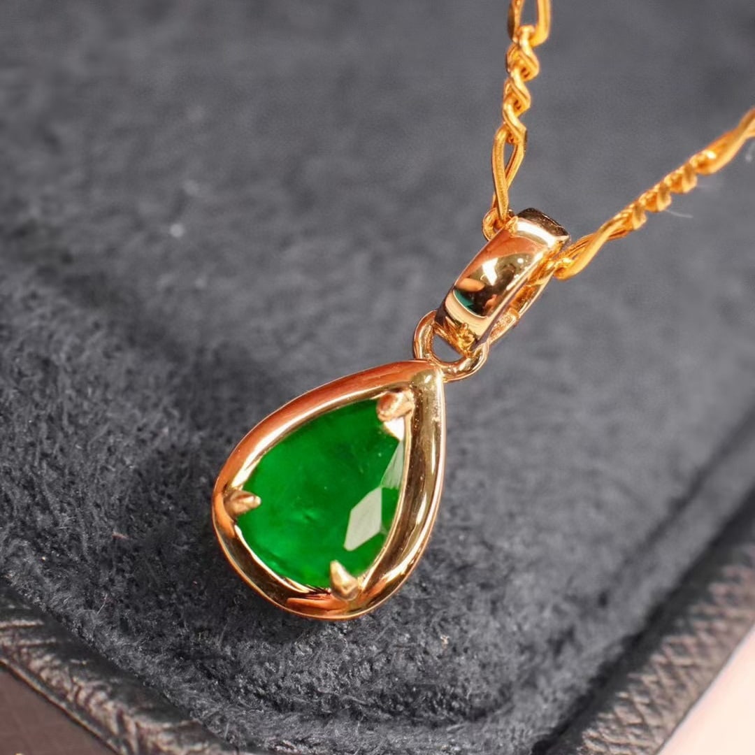 14k Gold 0.7 Ct Natural Emerald Pendant( Without Chain ): Ref:231001236 // gold content:14k gold // main gemstone:emerald // shape:pear // carat weight:0. 7ct // color:green // treatment:natural // Condition: New Low Estimate: 2200.00 High Estimate: 3300.00