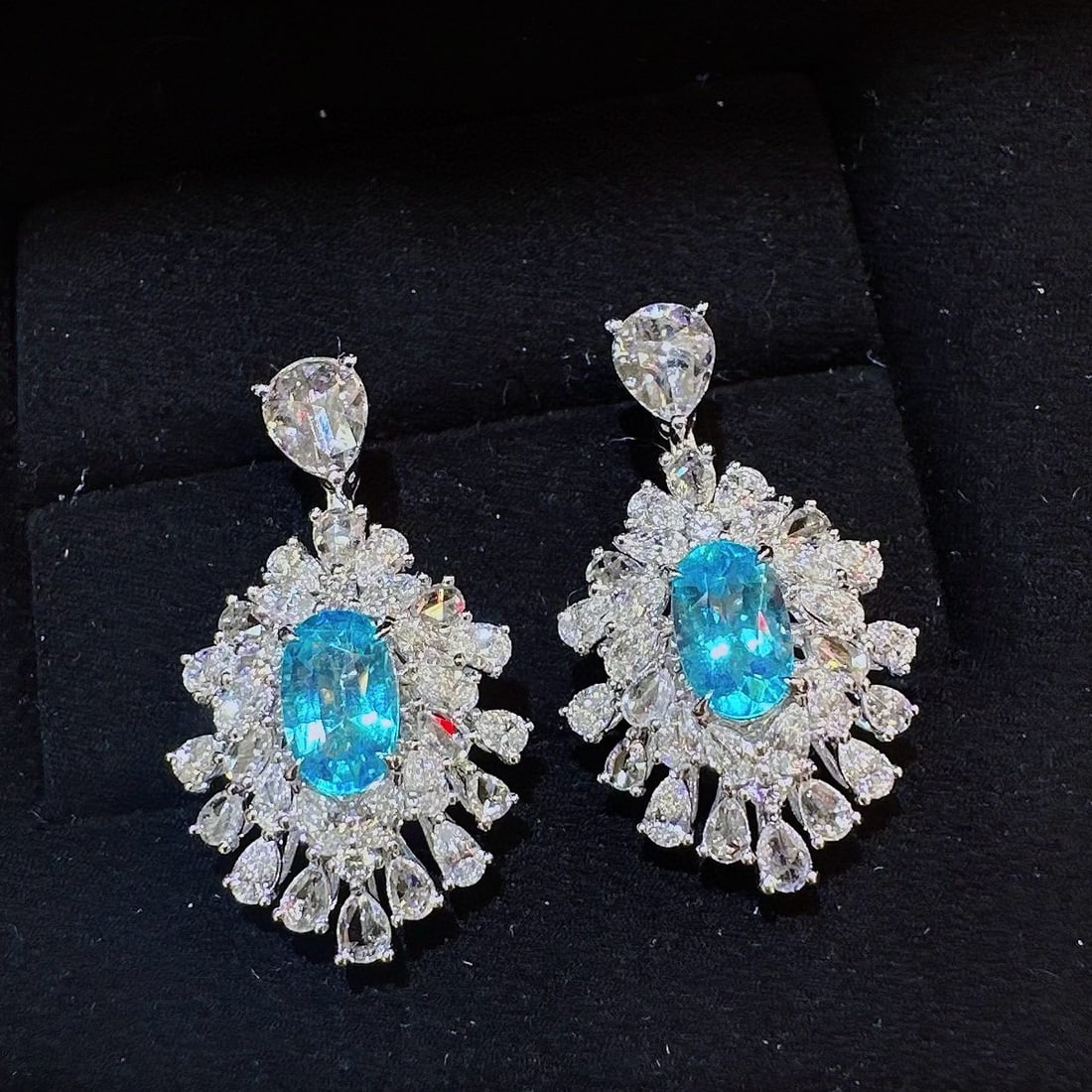 14k Gold 3.12 Ctw Natural Paraiba Tourmaline & Diamond Earrings: Ref:231001249 // gold content:14k gold // main gemstone:paraiba tourmaline // shape:oval // carat weight:1. 14ct // color:neon blue // treatment:natural // // adjacent gemstone 2 : diamond //