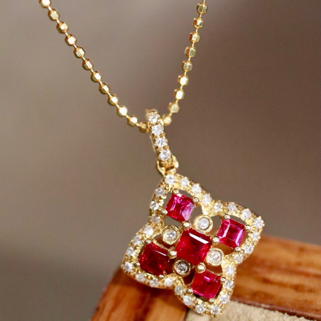 14k Gold 0.59 Ctw Natural Ruby & Diamond Pendant( Without Chain ): Ref:231001253 // gold content:14k gold // main gemstone:ruby // shape:square // carat weight:0. 48ct // color:red // treatment:natural // // adjacent gemstone 2 : diamond // shape:round // carat