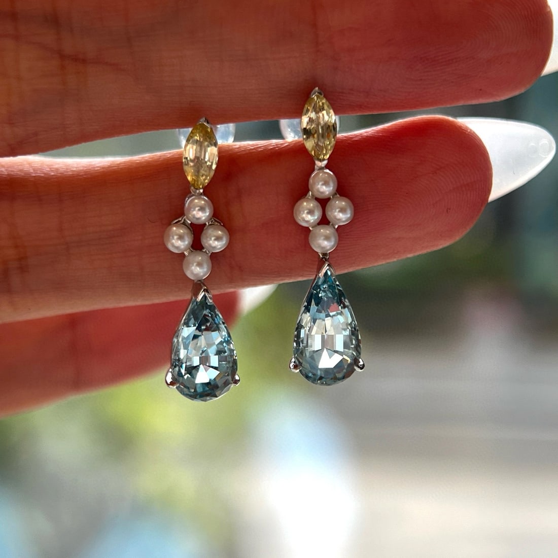 14k Gold 4.01 Ctw Natural Aquamarine & Sapphire Earrings: Ref:231001254 // gold content:14k gold // main gemstone:aquamarine // shape:pear // carat weight:3. 41ct // color:blue // treatment:natural // // adjacent gemstone 2 : sapphire // shape:marquise //