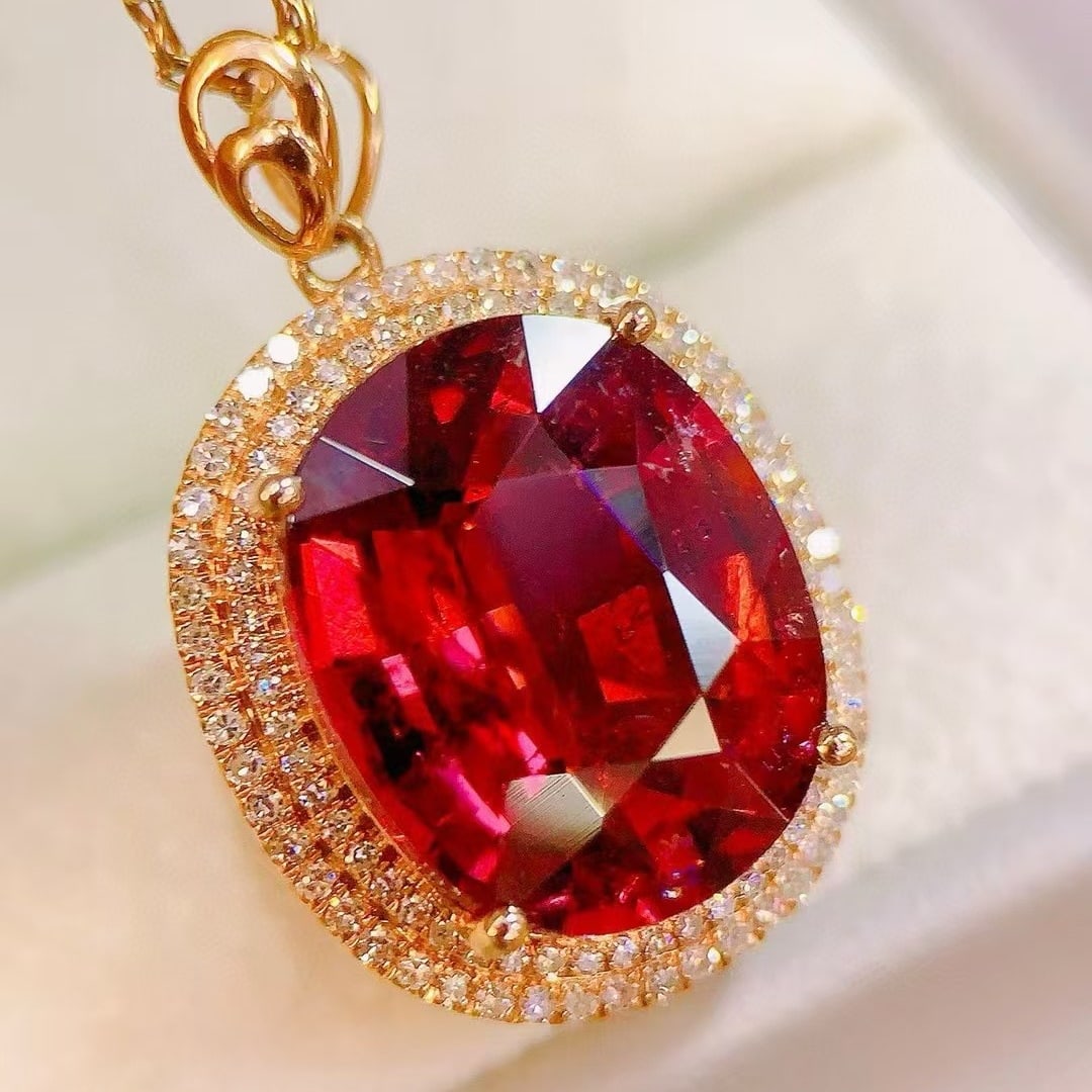 14k Gold 10.11 Ctw Natural Tourmaline & Diamond Pendant( Without Chain ): Ref:231002010 // gold content:14k gold // main gemstone:tourmaline // shape:oval // carat weight:9. 7ct // color:red // treatment:natural // // adjacent gemstone 2 : diamond // number of stones:104 //
