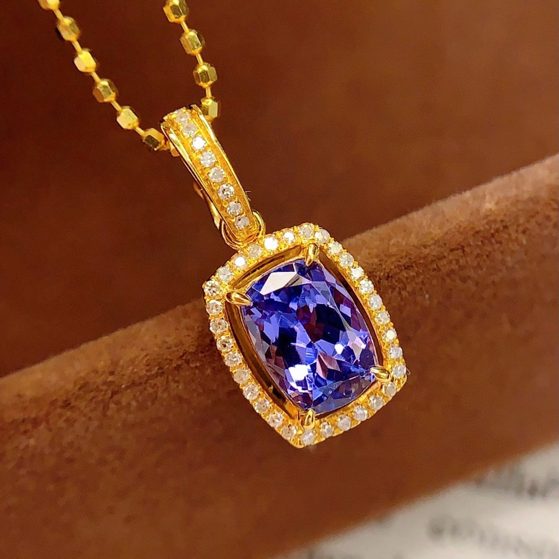 14k Gold 1.5 Ct Natural Tanzanite & Diamond Pendant( Without Chain ): Ref:231002014 // gold content:14k gold // main gemstone:tanzanite // shape:cushion // carat weight:1. 5ct // color:blue // treatment:natural // // adjacent gemstone 2 : diamond // number of stones:41