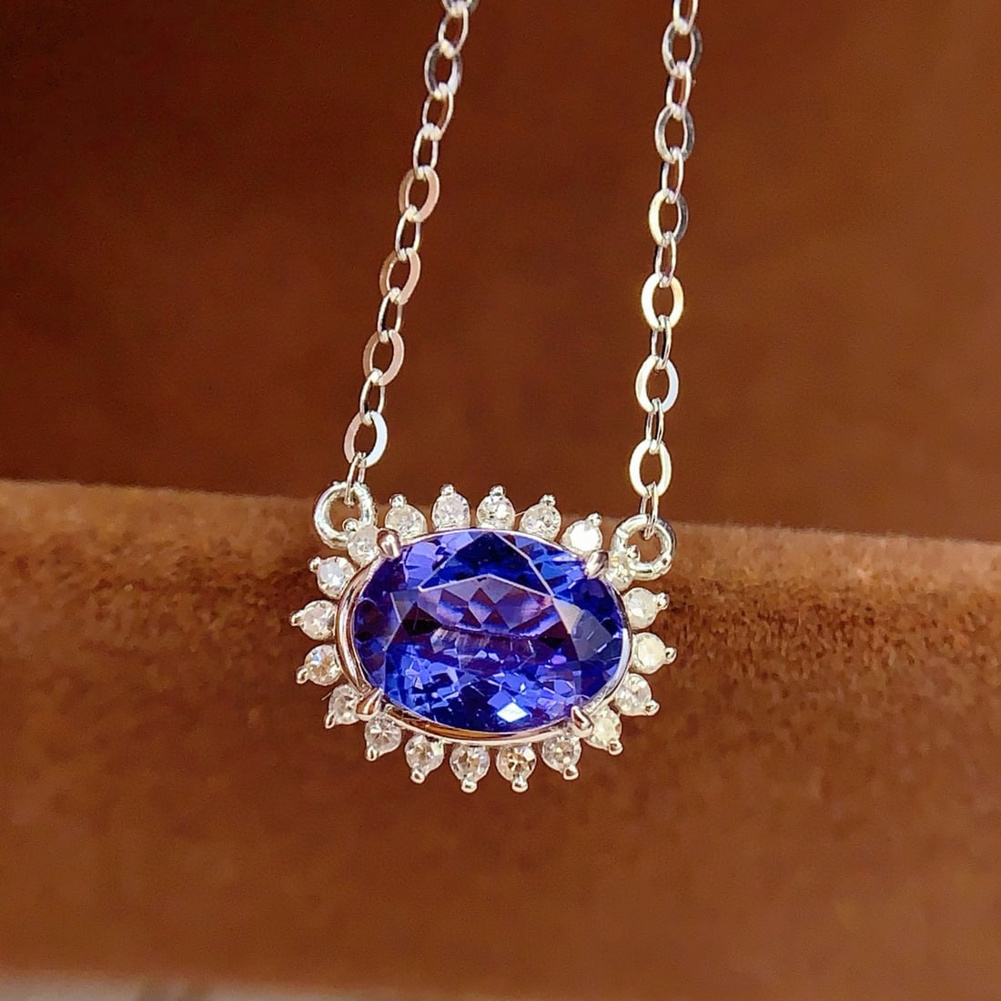 14k Gold 1.3 Ct Natural Tanzanite & Diamond Necklace: Ref:231002015 // gold content:14k gold // main gemstone:tanzanite // shape:oval // carat weight:1. 3ct // color:blue // treatment:natural // // adjacent gemstone 2 : diamond // number of stones:20 //