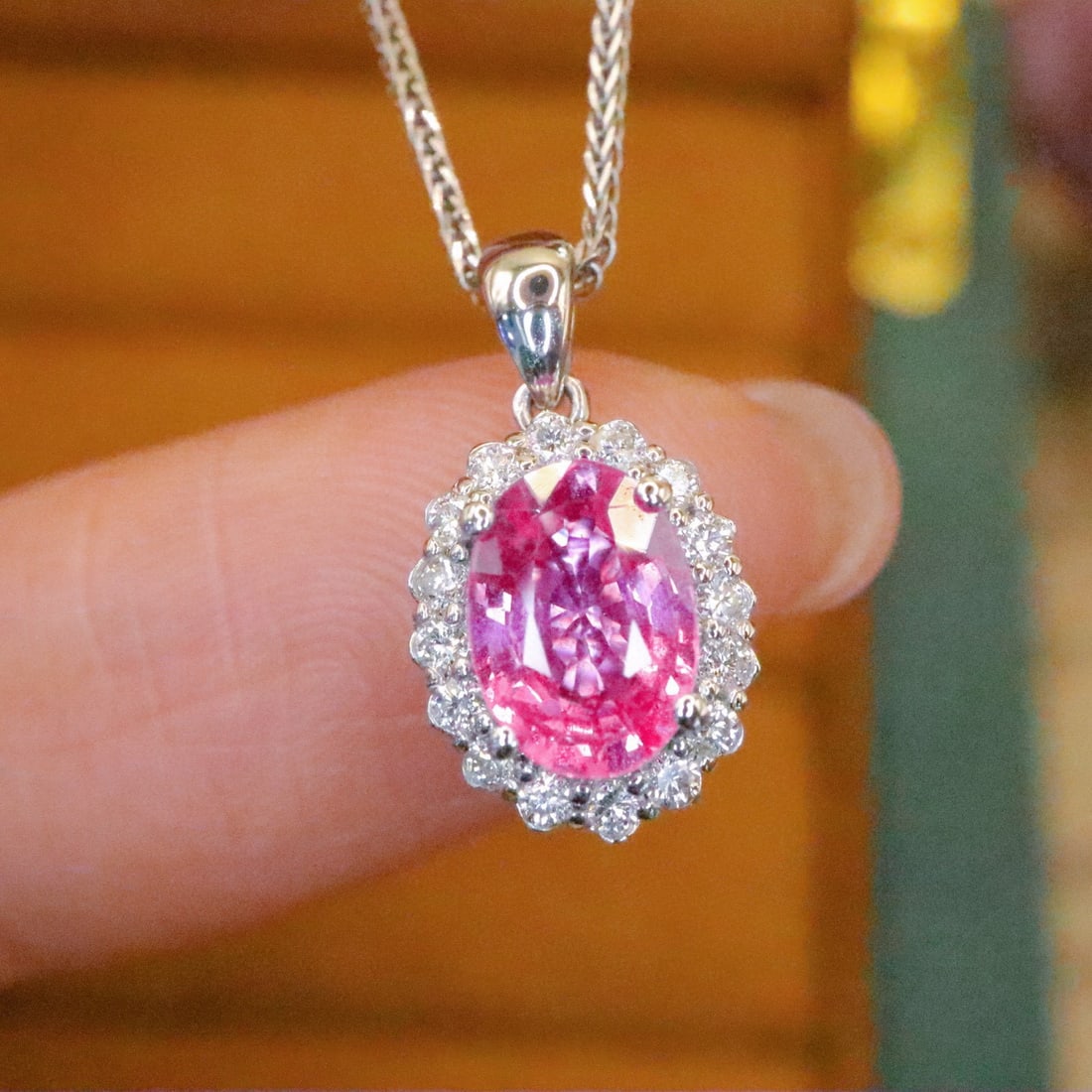 14k Gold 1.06 Ctw Natural Padparadscha Sapphire & Diamond Pendant( Without Chain ): Ref:231002128 // gold content:14k gold // main gemstone:padparadscha sapphire // shape:oval // carat weight:0. 90ct // color:orangish pink // treatment:natural // // adjacent gemstone 2 : diamond //