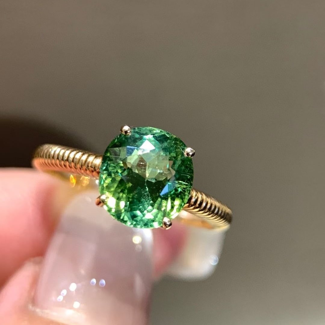 14k Gold 2.45 Ct Natural Tourmaline Ring: Ref:231002152 // gold content:14k gold // ring size:7. 25us // // main gemstone:tourmaline // shape:oval // carat weight:2. 45ct // color:green // treatment:natural // Condition: New Low Estimate: