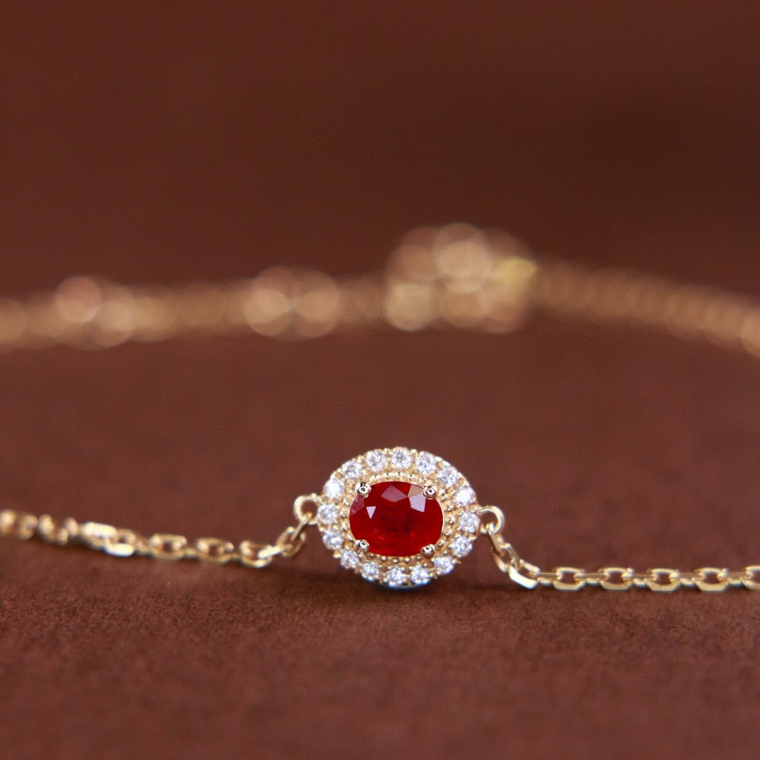 14k Gold 0.41 Ctw Natural Ruby & Diamond Bracelet: Ref:231002174 // gold content:14k gold // main gemstone:ruby // shape:oval // carat weight:0. 35ct // color:pigeonblood red // treatment:natural // // adjacent gemstone 2 : diamond // shape:round //