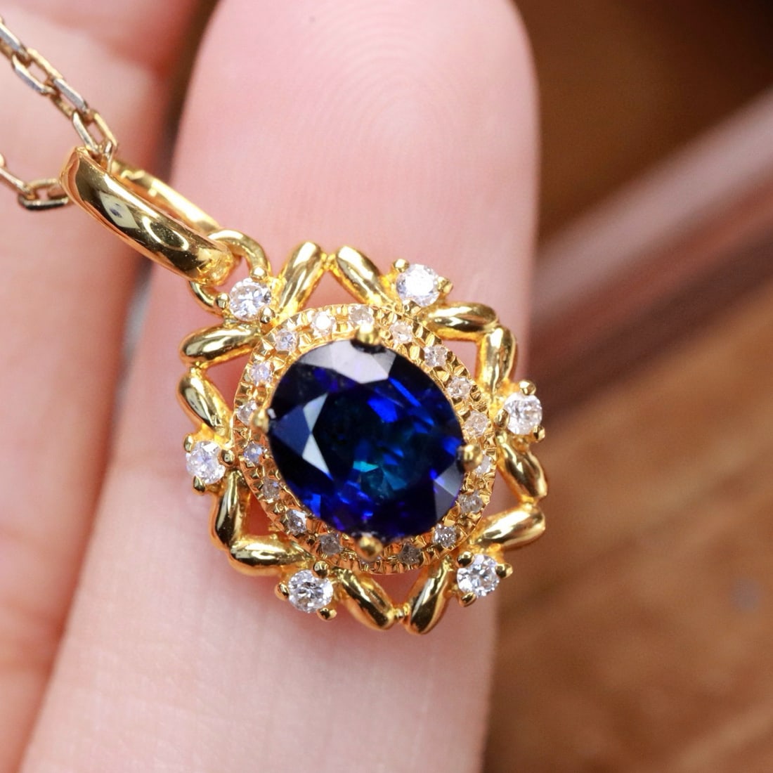 14k Gold 0.91 Ctw Natural Sapphire & Diamond Pendant( Without Chain ): Ref:231002223 // gold content:14k gold // main gemstone:sapphire // shape:oval // carat weight:0. 80ct // color:royal blue // treatment:natural // // adjacent gemstone 2 : diamond // shape:round //