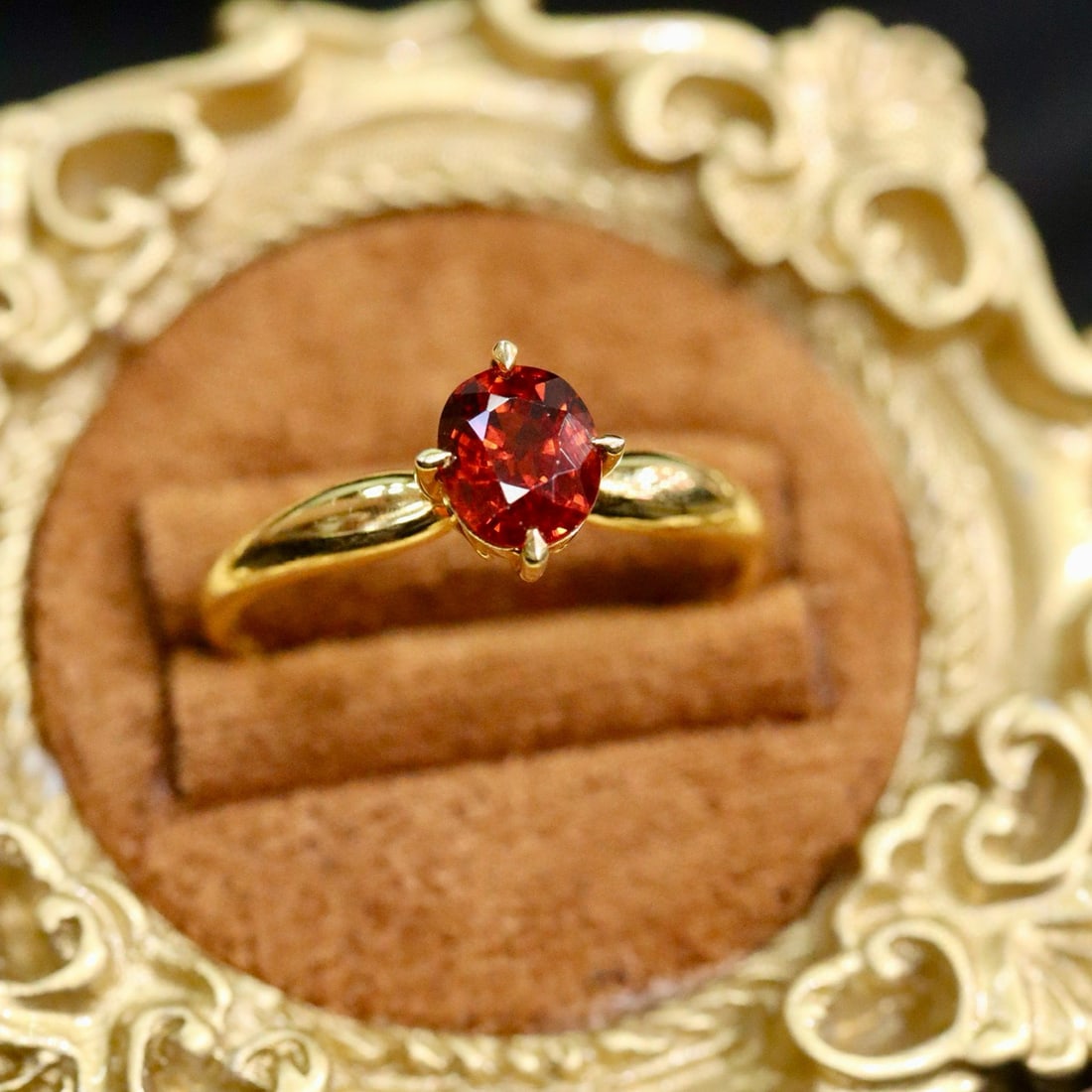 14k Gold 0.42 Ct Natural Spessartine Ring: Ref:231002256 // gold content:14k gold // ring size:7. 25us // // main gemstone:spessartine // shape:oval // carat weight:0. 42ct // color:orange // treatment:natural // Condition: New Low Estimate: