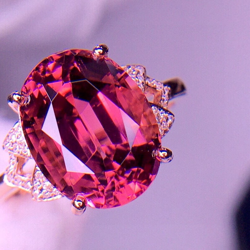 14k Gold 5.8 Ct Natural Tourmaline & Diamond Ring: Ref:231002262 // gold content:14k gold // ring size:7. 25us // // main gemstone:tourmaline // shape:oval // carat weight:5. 8ct // color:red // treatment:natural // // adjacent gemstone 2 : diamond