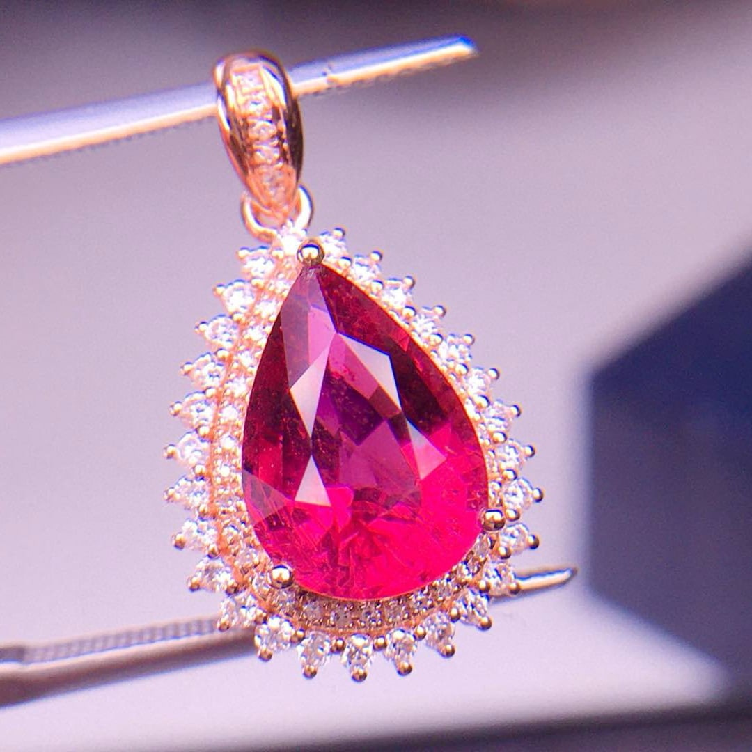 14k Gold 4.13 Ct Natural Tourmaline & Diamond Pendant( Without Chain ): Ref:231002263 // gold content:14k gold // main gemstone:tourmaline // shape:pear // carat weight:4. 13ct // color:red // treatment:natural // // adjacent gemstone 2 : diamond // shape:round //