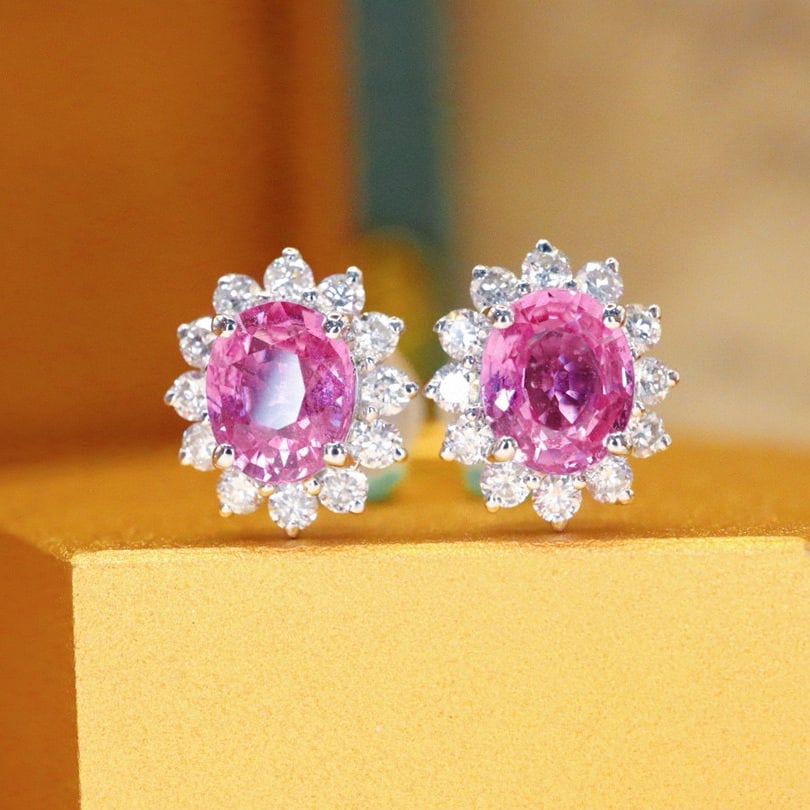 14k Gold 1.24 Ctw Natural Padparadscha Sapphire & Diamond Earrings: Ref:231002288 // gold content:14k gold // main gemstone:padparadscha sapphire // shape:oval // carat weight:0. 95ct // color:orangish pink // treatment:natural // // adjacent gemstone 2 : diamond //