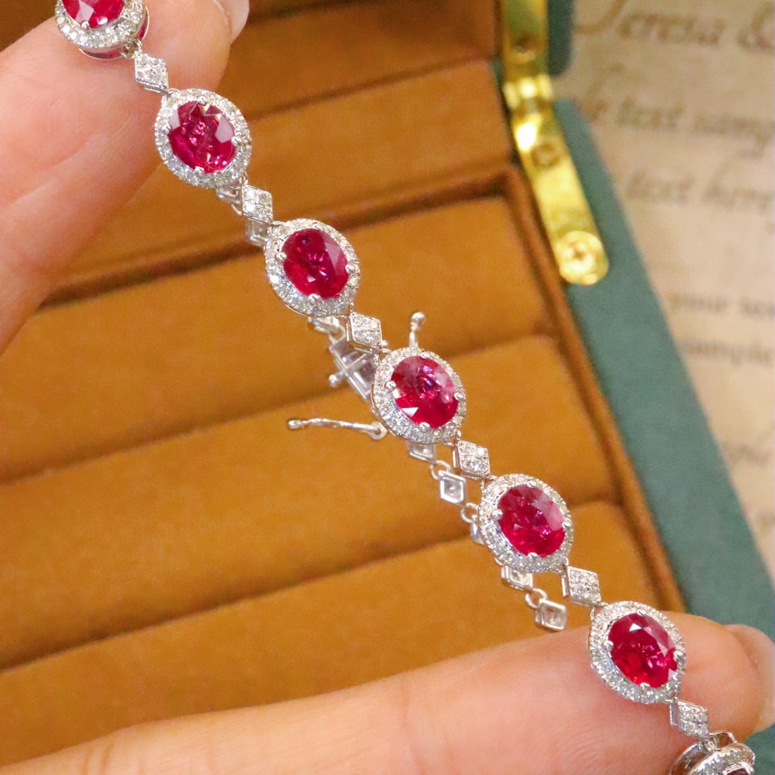 14k Gold 4.24 Ctw Natural Ruby & Diamond Bracelet: Ref:231002308 // gold content:14k gold // main gemstone:ruby // shape:oval // carat weight:3. 45ct // color:red // treatment:natural // // adjacent gemstone 2 : diamond // number of stones:172 //