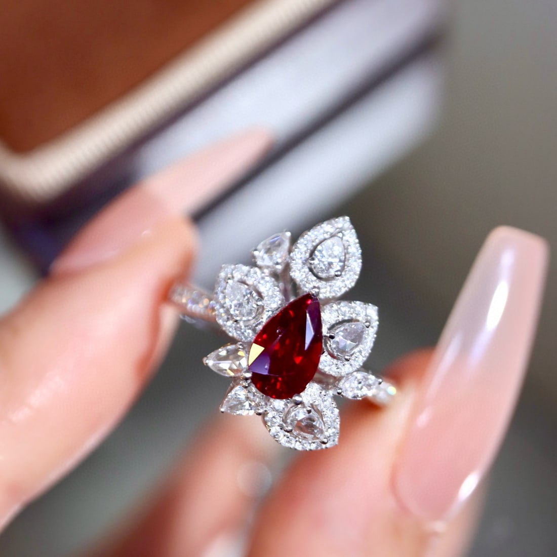 14k Gold 1.65 Ctw Natural Ruby & Diamond Ring: Ref:231002309 // gold content:14k gold // ring size:7. 25us // // main gemstone:ruby // shape:pear // carat weight:1. 05ct // color:pigeonblood red // treatment:natural // // adjacent gemstone 2 :