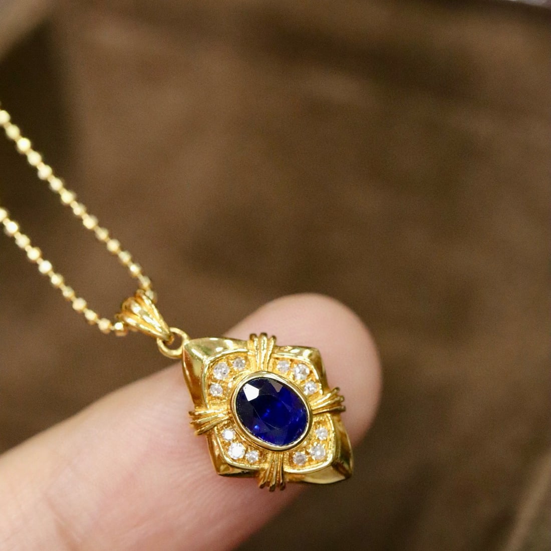 14k Gold 0.46 Ctw Natural Sapphire & Diamond Pendant( Without Chain ): Ref:231002318 // gold content:14k gold // main gemstone:sapphire // shape:oval // carat weight:0. 41ct // color:blue // treatment:natural // // adjacent gemstone 2 : diamond // shape:round // carat