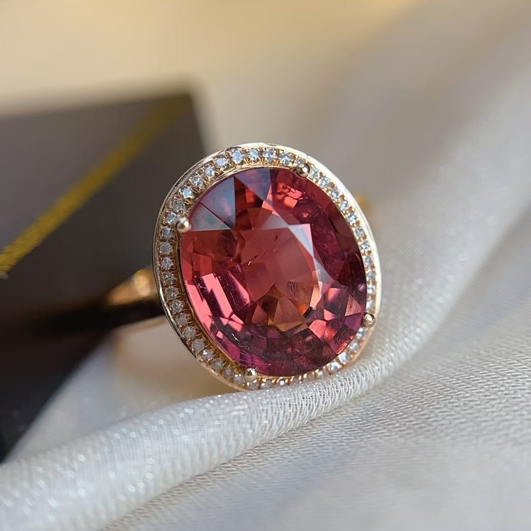 14k Gold 4.20 Ct Natural Tourmaline & Diamond Ring: Ref:231002329 // gold content:14k gold // ring size:7. 25us // // main gemstone:tourmaline // shape:oval // carat weight:4. 20ct // color:red // treatment:natural // // adjacent gemstone 2 : diamond