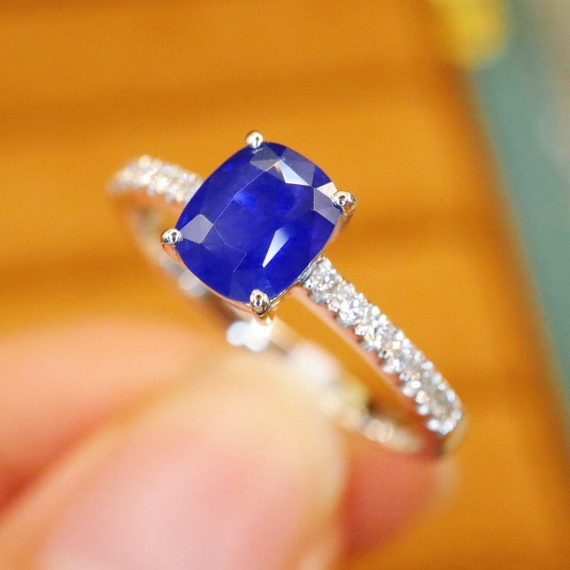 14k Gold 1.24 Ctw Natural Sapphire & Diamond Ring: Ref:231002348 // gold content:14k gold // ring size:7. 25us // // main gemstone:sapphire // shape:cushion // carat weight:1. 10ct // color:royal blue // treatment:natural // // adjacent gemstone 2 :
