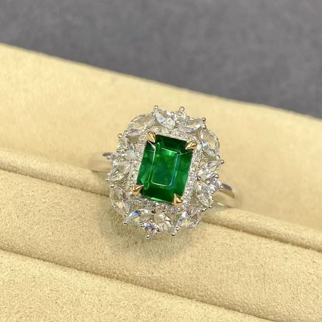 14k Gold 1.44 Ctw Vivid Green Natural Emerald & Sapphire Ring: Ref:231002433 // gold content:14k gold // ring size:7. 25us // // main gemstone:emerald // shape:octagonal // carat weight:0. 78ct // color:vivid green // treatment:natural // // adjacent gemstone 2