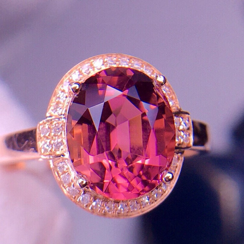 14k Gold 2.96 Ct Natural Tourmaline & Diamond Ring: Ref:231002443 // gold content:14k gold // ring size:7. 25us // // main gemstone:tourmaline // shape:oval // carat weight:2. 96ct // color:red // treatment:natural // // adjacent gemstone 2 : diamond