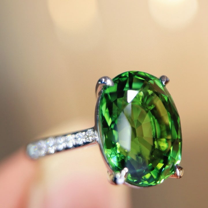 14k Gold 6.37 Ctw Natural Tourmaline & Diamond Ring: Ref:231002444 // gold content:14k gold // ring size:7. 25us // // main gemstone:tourmaline // shape:oval // carat weight:6. 20ct // color:green // treatment:natural // // adjacent gemstone 2 :