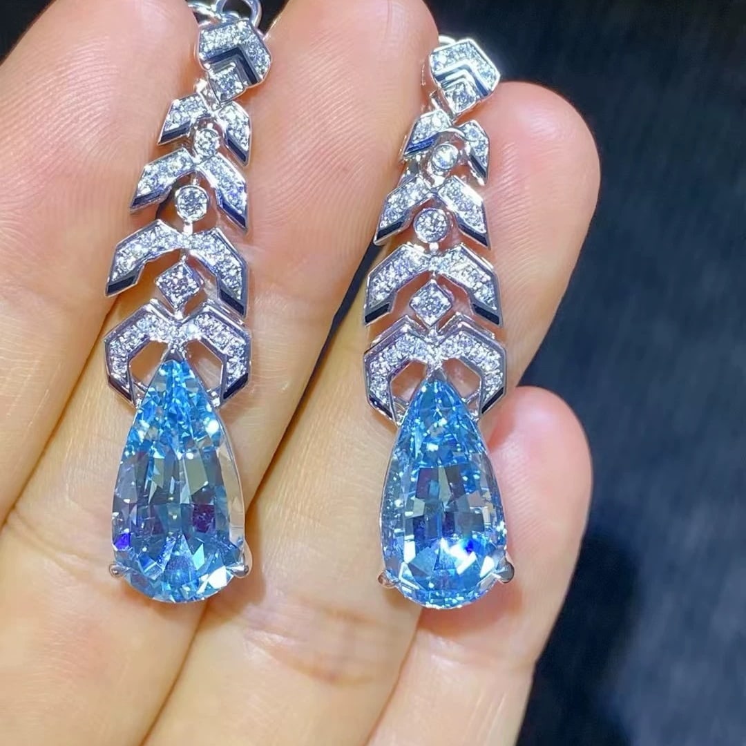 14k Gold 11.27 Ctw Natural Aquamarine & Diamond Earrings: Ref:231007042 // gold content:14k gold // main gemstone:aquamarine // shape:pear // carat weight:10. 88ct // color:santa maria color // treatment:natural // // adjacent gemstone 2 : diamond // shape:r