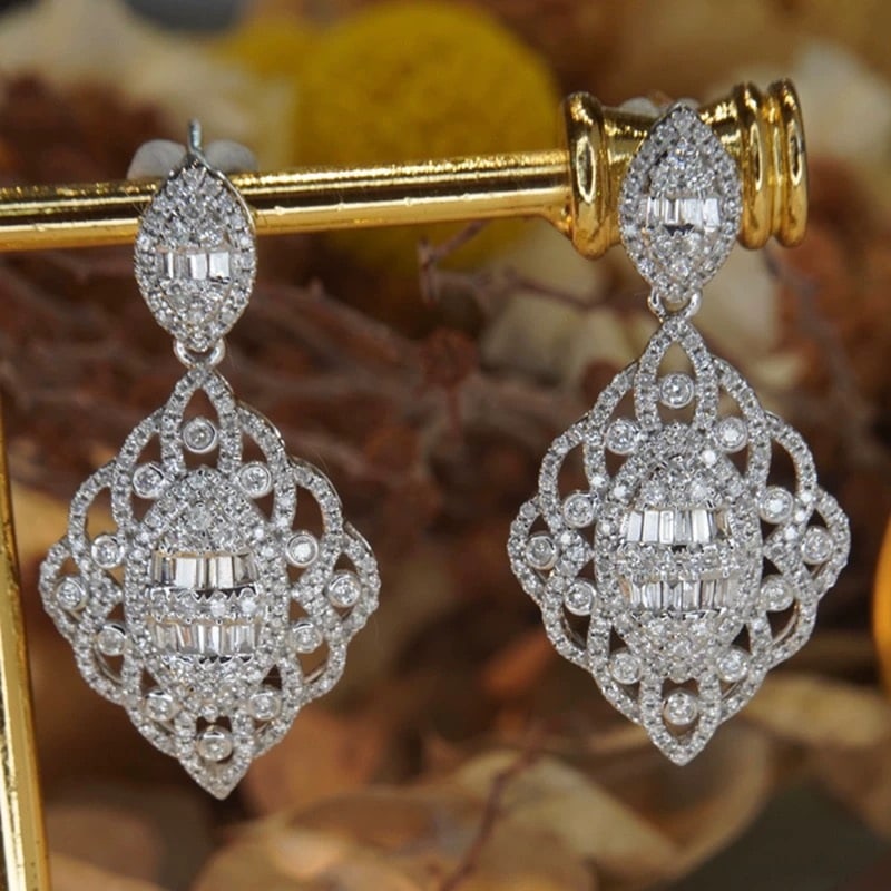 14k Gold 1.5 Ct Natural H Diamond Earrings: Ref:231007052 // gold content:14k gold // main gemstone:diamond // shape:multiply // carat weight:1. 5ct // clarity grade:vs-si // color:h // treatment:natural // Condition: New Low Estimate: 6800.00 