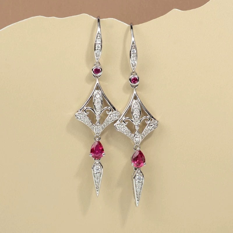 14k Gold 0.52 Ctw Natural Ruby & Diamond Earrings: Ref:231007078 // gold content:14k gold // main gemstone:ruby // shape:pear // carat weight:0. 4ct // color:red // treatment:natural // // adjacent gemstone 2 : diamond // shape:round // carat