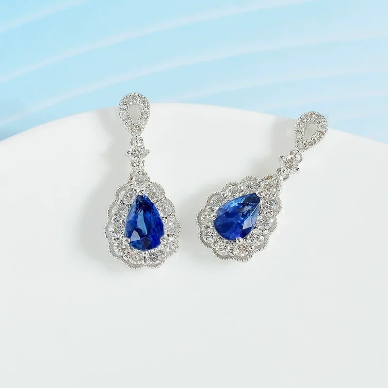 14k Gold 1.59 Ctw Natural Sapphire & Diamond Earrings: Ref:231007079 // gold content:14k gold // main gemstone:sapphire // shape:pear // carat weight:1. 1ct // color:blue // treatment:natural // // adjacent gemstone 2 : diamond // shape:round // carat wei