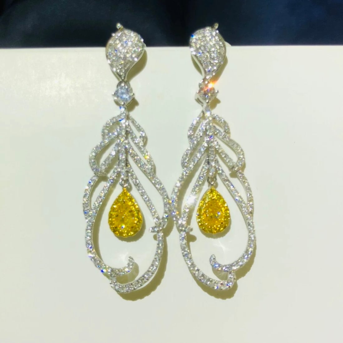 14k Gold 1.58 Ctw Natural Yellow Diamond & Diamond Earrings: Ref:231007089 // gold content:14k gold // main gemstone:yellow diamond // shape:pear // carat weight:0. 5ct // color:yellow // treatment:natural // // adjacent gemstone 2 : diamond // shape:round //