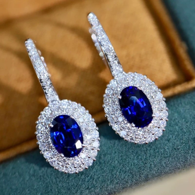 14k Gold 1.91 Ctw Natural Sapphire & Diamond Earrings: Ref:231007131 // gold content:14k gold // main gemstone:sapphire // shape:oval // carat weight:1. 4ct // color:blue // treatment:natural // // adjacent gemstone 2 : diamond // shape:round // carat