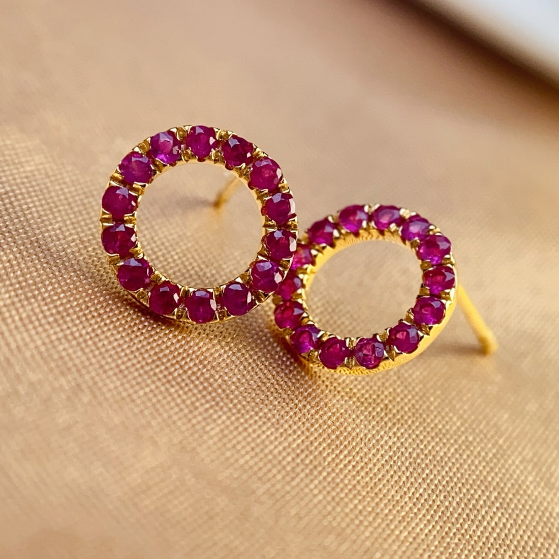 14k Gold 1 Ct Natural Ruby Earrings: Ref:231007181 // gold content:14k gold // main gemstone:ruby // shape:round // carat weight:1ct // color:red // treatment:natural // cut grade:g // Condition: New Low Estimate: 1700 High Estimate: