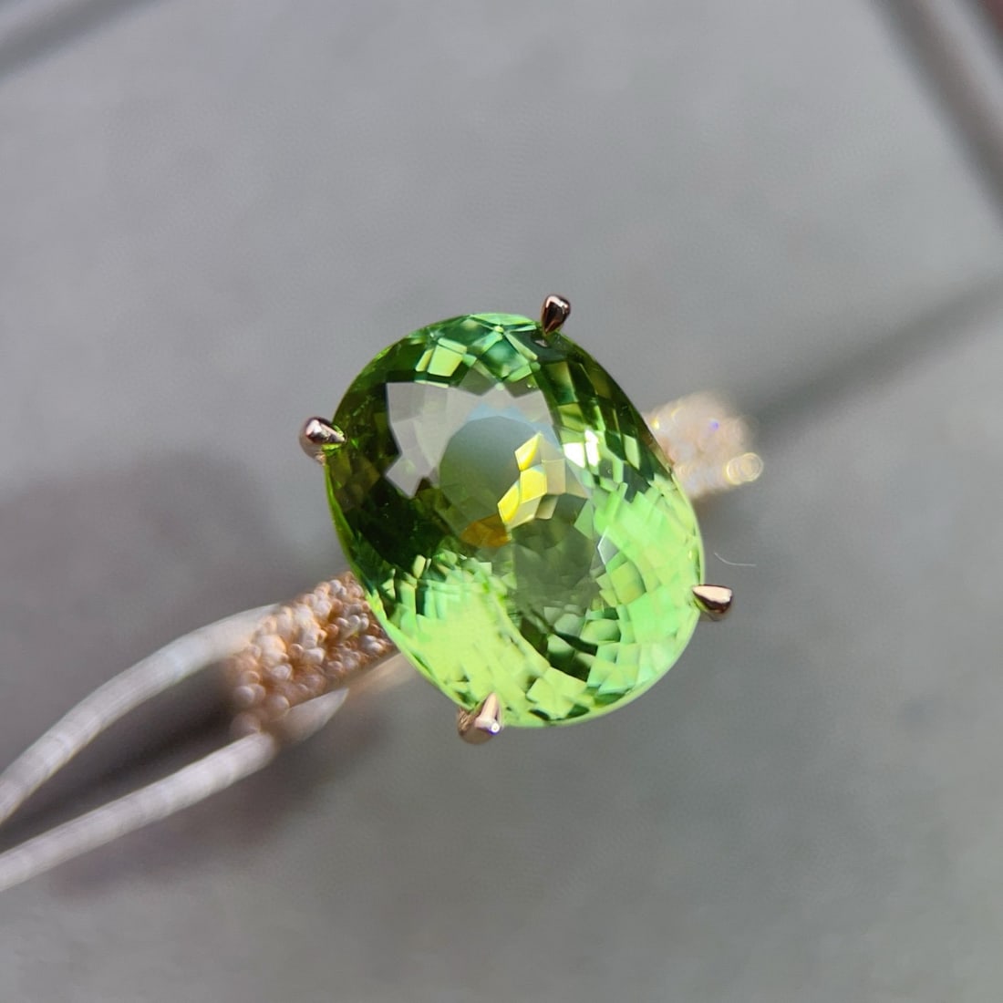 14k Gold 6.92 Ctw Natural Tourmaline & Diamond Ring: Ref:231008015 // gold content:14k gold // ring size:7. 25us // // main gemstone:tourmaline // shape:oval // carat weight:6. 79ct // color:green // treatment:natural // // adjacent gemstone 2 :