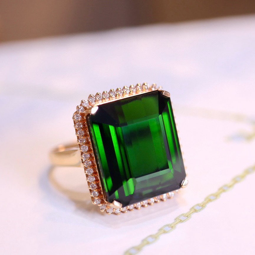 14k Gold 22.1 Ct Natural Tourmaline & Diamond Ring: Ref:231008019 // gold content:14k gold // ring size:7. 25us // // main gemstone:tourmaline // shape:octagonal // carat weight:22. 1ct // color:green // treatment:natural // // adjacent gemstone 2 :