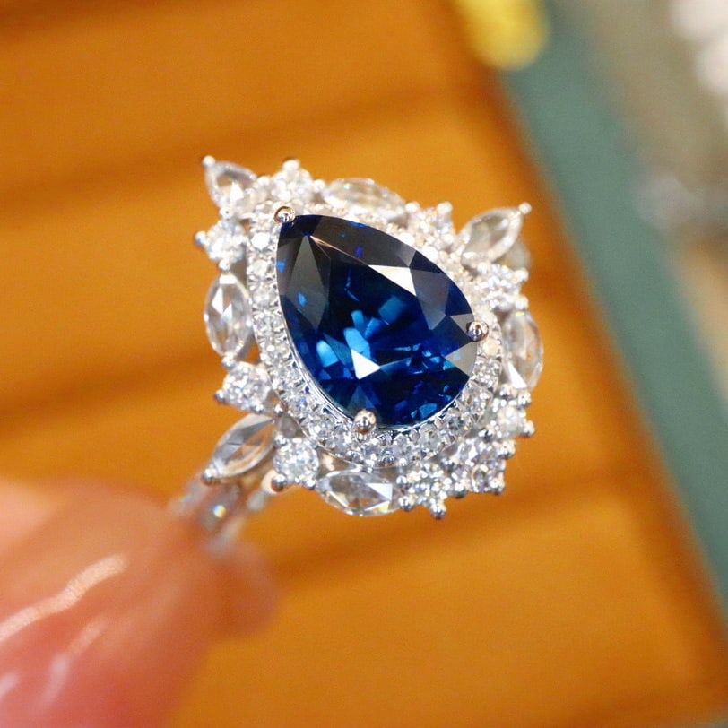 14k Gold 2.51 Ctw Natural Sapphire & Diamond Ring: Ref:231008027 // gold content:14k gold // ring size:7. 25us // // main gemstone:sapphire // shape:pear // carat weight:2. 01ct // color:royal blue // treatment:natural // // adjacent gemstone 2 :