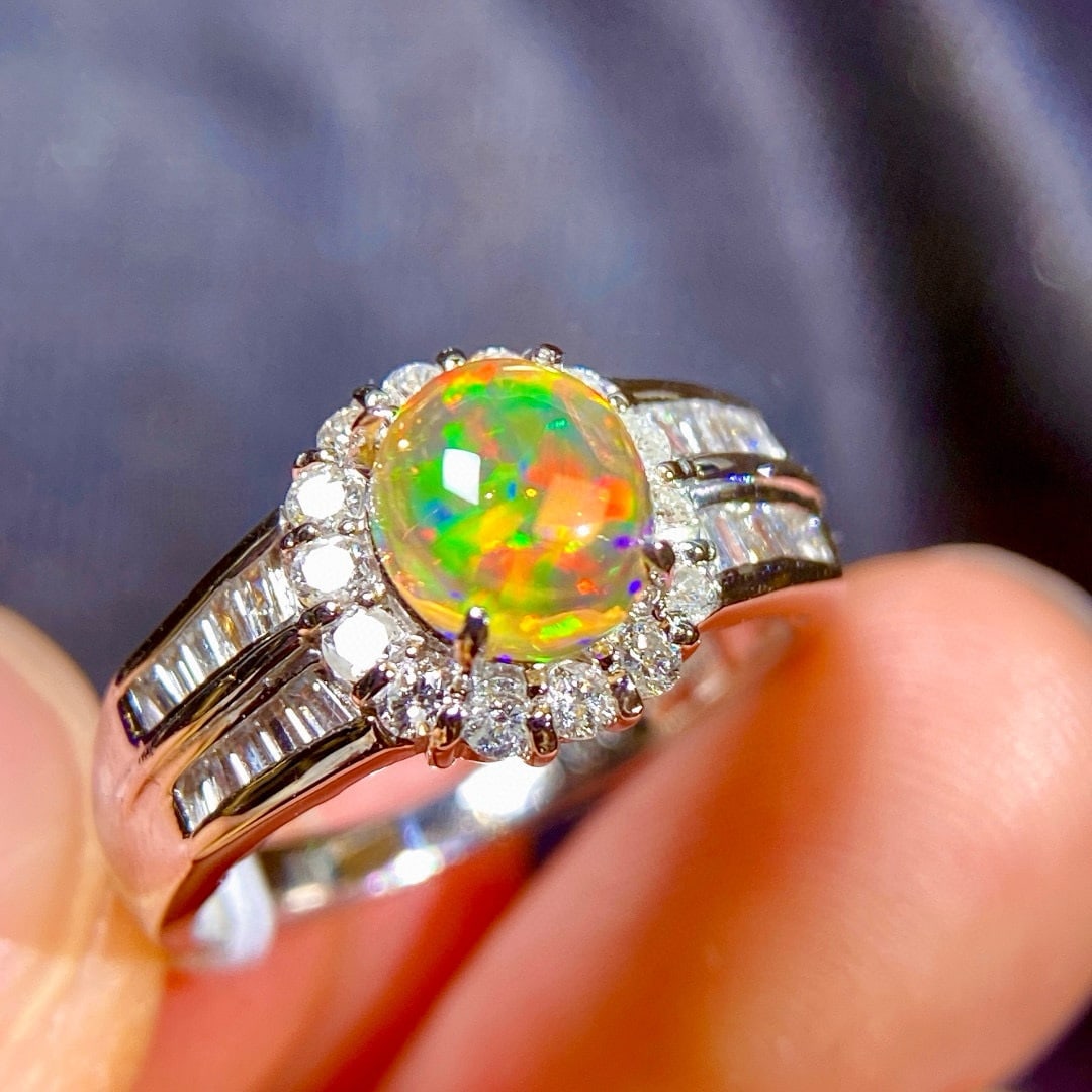 14k Gold 1.69 Ctw Natural Opal & Diamond Ring: Ref:231008062 // gold content:14k gold // ring size:7. 25us // // main gemstone:opal // shape:oval // carat weight:1. 18ct // color:color // treatment:natural // // adjacent gemstone 2 : diamond //