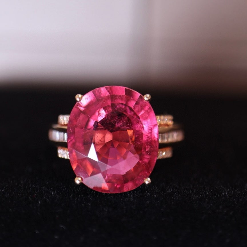 14k Gold 8.48 Ct Natural Tourmaline & Diamond Ring: Ref:231008073 // gold content:14k gold // ring size:7. 25us // // main gemstone:tourmaline // shape:oval // carat weight:8. 48ct // color:red // treatment:natural // // adjacent gemstone 2 : diamond /