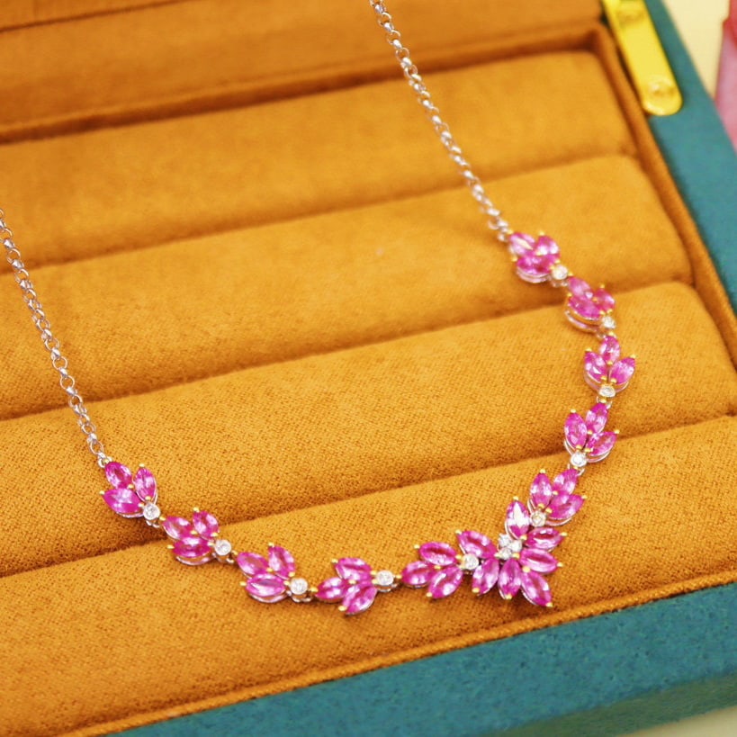 14k Gold 7.35 Ctw Natural Padparadscha Sapphire & Diamond Necklace: Ref:231008076 // gold content:14k gold // main gemstone:padparadscha sapphire // shape:marquise // carat weight:7. 20ct // color:orangish pink // treatment:natural // // adjacent gemstone 2 : diamond 