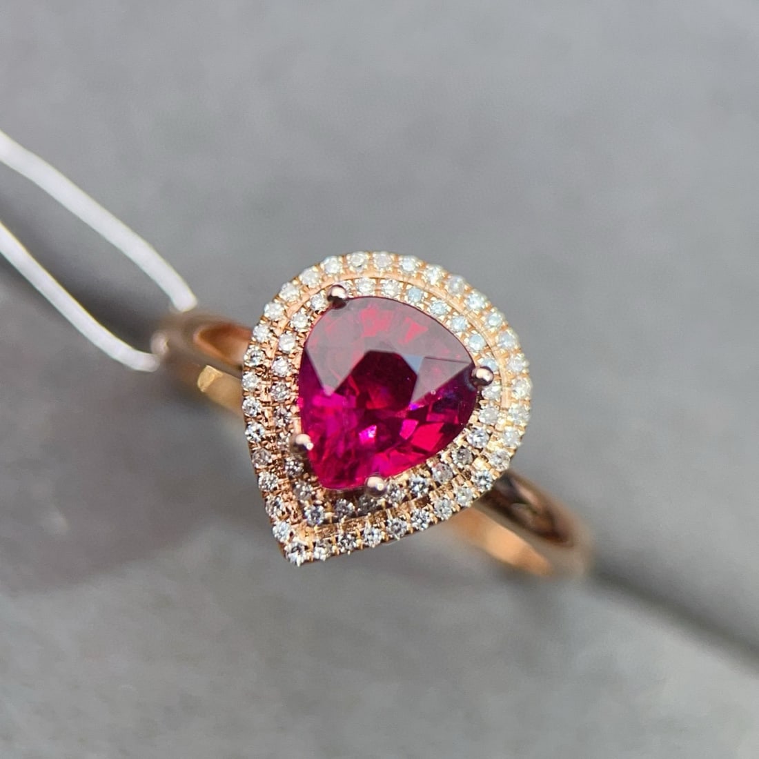 14k Gold 1.37 Ctw Natural Tourmaline & Diamond Ring: Ref:231008115 // gold content:14k gold // ring size:7. 25us // // main gemstone:tourmaline // shape:pear // carat weight:1. 18ct // color:red // treatment:natural // // adjacent gemstone 2 : diamond