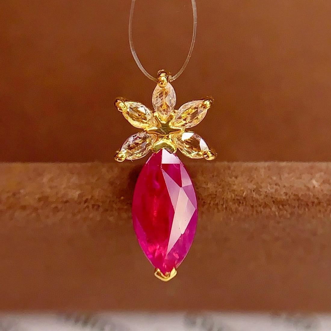 14k Gold 0.85 Ct Natural Ruby & Sapphire Pendant( Without Chain ): Ref:231008118 // gold content:14k gold // main gemstone:ruby // shape:marquise // carat weight:0. 85ct // color:red // treatment:natural // // adjacent gemstone 2 : sapphire // number of stones:5 //