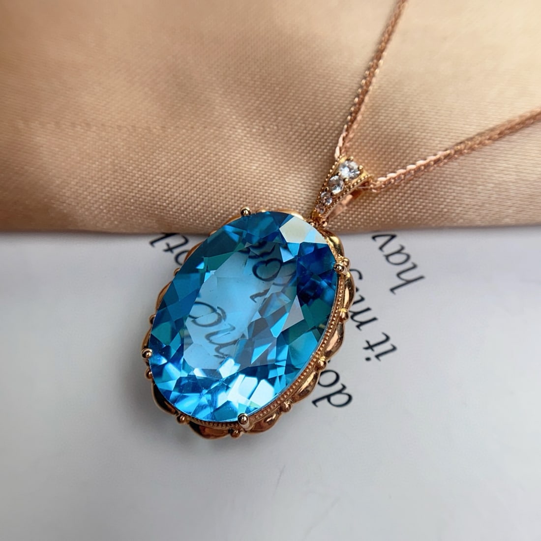 14k Gold 23.50 Ct Natural Topaz & Sapphire Pendant( Without Chain ): Ref:231008122 // gold content:14k gold // main gemstone:topaz // shape:oval // carat weight:23. 50ct // color:blue // treatment:natural // // adjacent gemstone 2 : sapphire // number of stones:4 // sh
