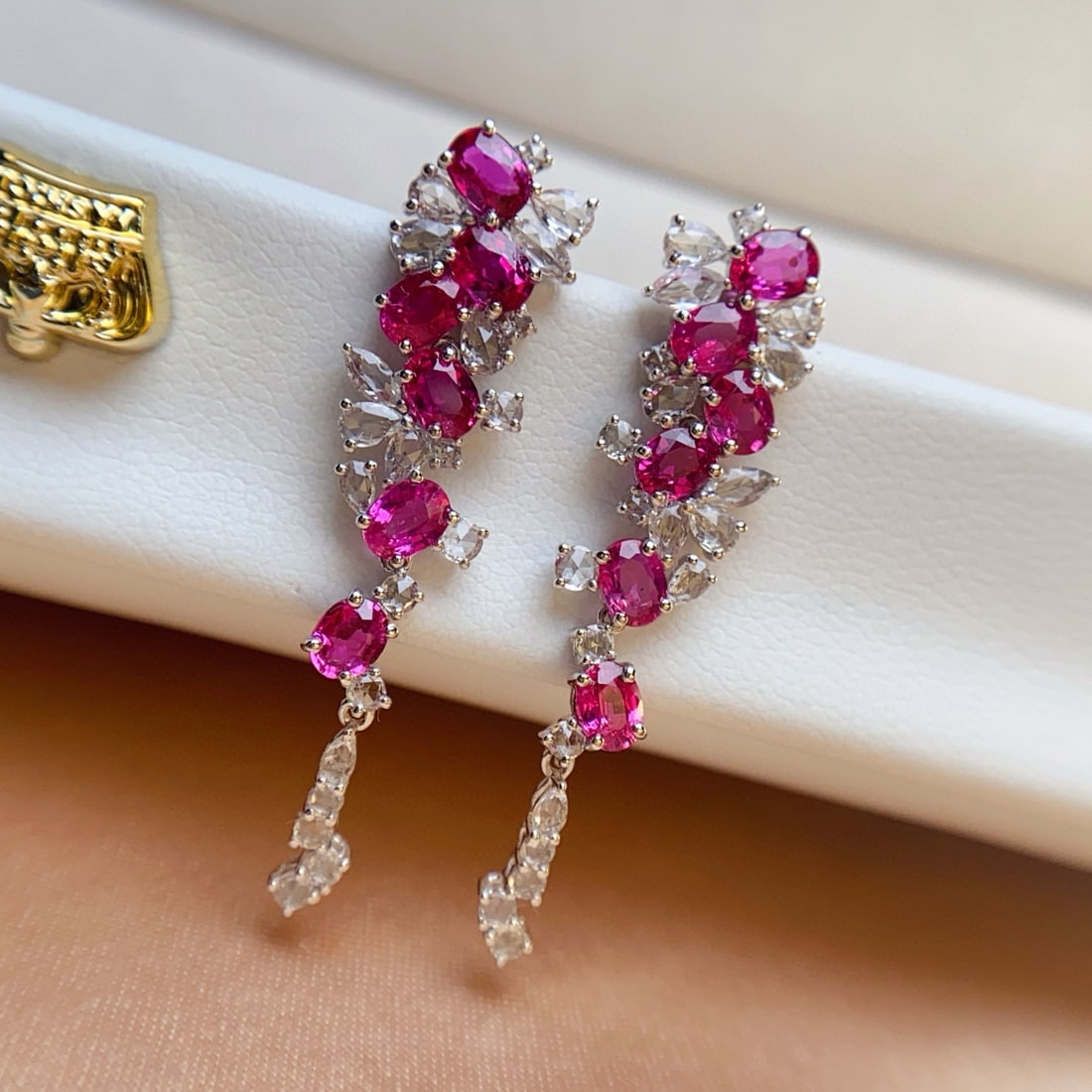 14k Gold 3.85 Ct Natural Ruby & Sapphire Earrings: Ref:231008138 // gold content:14k gold // main gemstone:ruby // shape:oval // carat weight:3. 85ct // color:red // treatment:natural // // adjacent gemstone 2 : sapphire // number of stones:42 //
