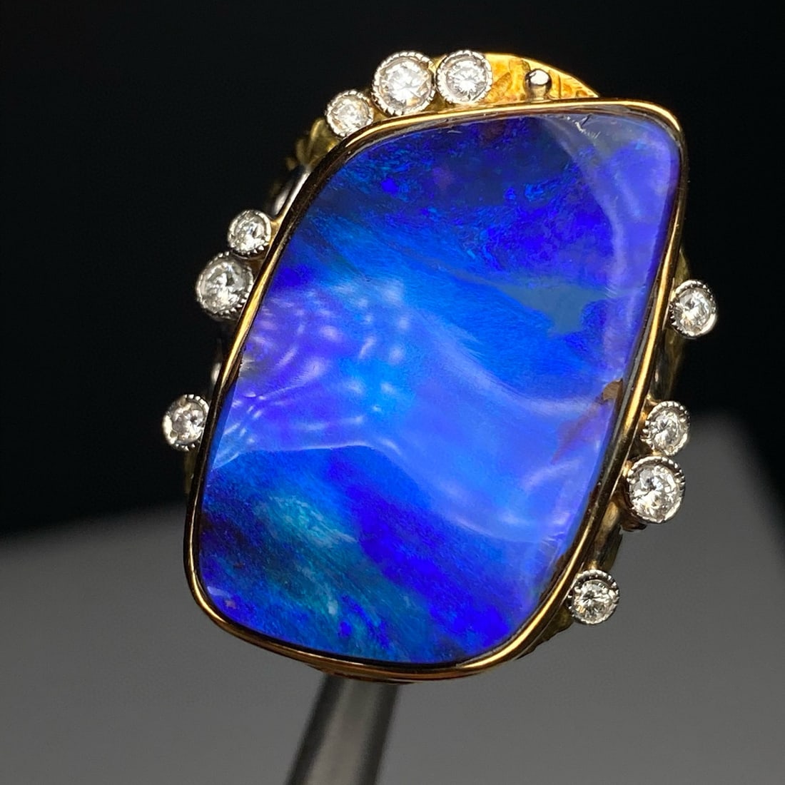 14k Gold 14.73 Ctw Natural Opal & Diamond Ring: Ref:231008145 // gold content:14k gold // ring size:7. 25us // // main gemstone:opal // shape:other // carat weight:14. 49ct // color:blue // treatment:natural // // adjacent gemstone 2 : diamond //