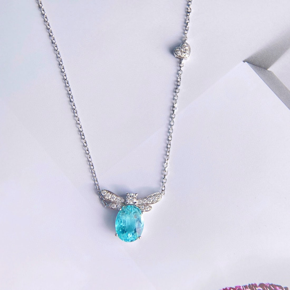 14k Gold 2.60 Ctw Natural Paraiba Tourmaline & Diamond Necklace: Ref:231008150 // gold content:14k gold // main gemstone:paraiba tourmaline // shape:oval // carat weight:2. 30ct // color:blue // treatment:natural // // adjacent gemstone 2 : diamond // shape:round