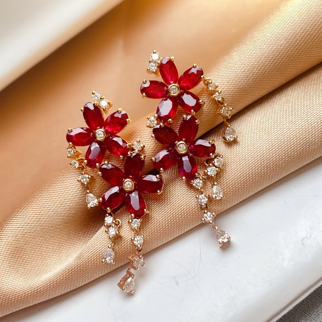 14k Gold 6.85 Ct Vivid Red Natural Ruby & Diamond Earrings: Ref:231008167 // gold content:14k gold // main gemstone:ruby // shape:oval // carat weight:6. 85ct // color:vivid red // treatment:natural // // adjacent gemstone 2 : diamond // number of stones:33