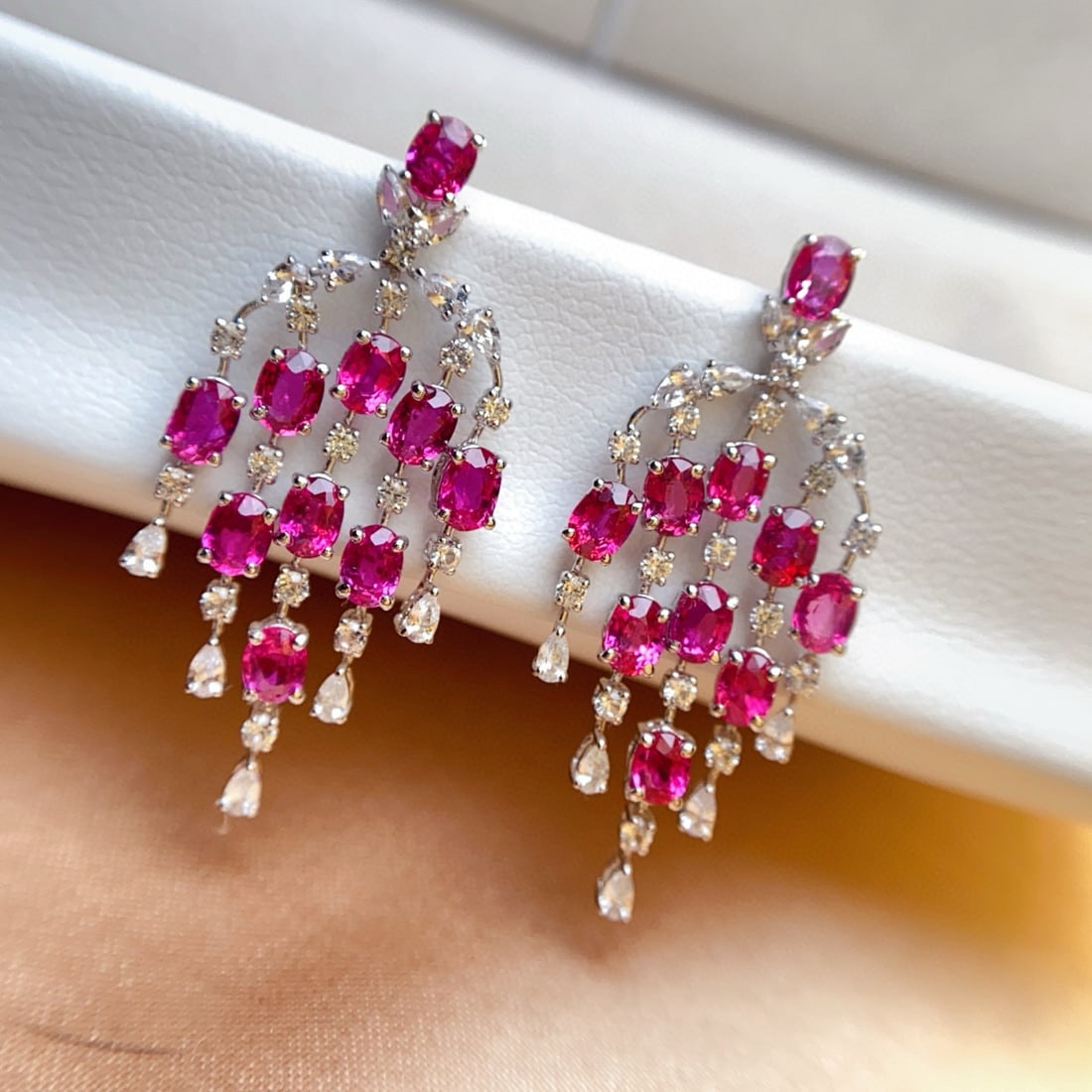 14k Gold 5.30 Ct Natural Ruby & Sapphire Earrings: Ref:231008171 // gold content:14k gold // main gemstone:ruby // shape:oval // carat weight:5. 30ct // color:red // treatment:natural // // adjacent gemstone 2 : sapphire // number of stones:52 //