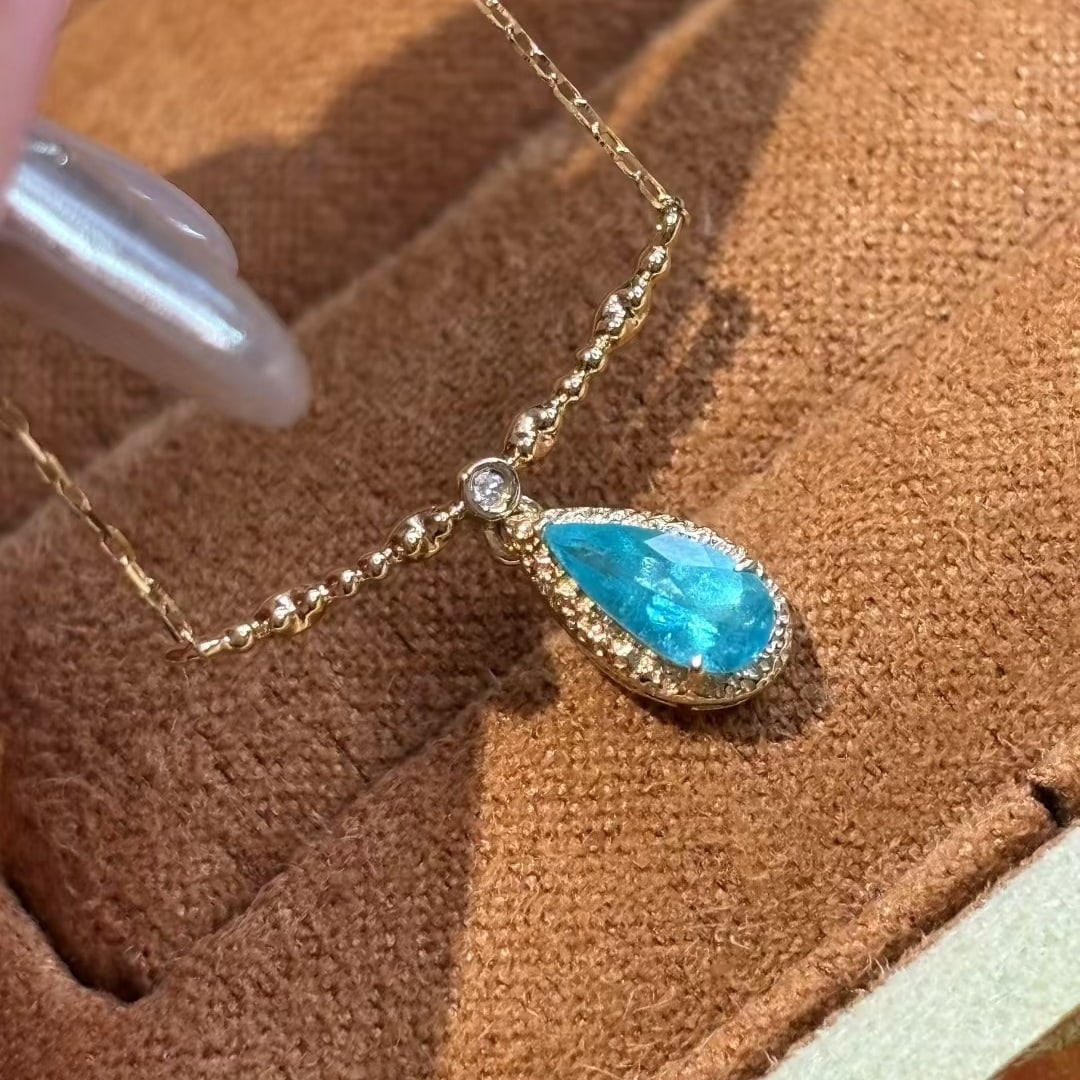 14k Gold 0.3 Ct Natural Paraiba Tourmaline & Diamond Necklace: Ref:231008218 // gold content:14k gold // main gemstone:paraiba tourmaline // shape:pear // carat weight:0. 3ct // color:blue // treatment:natural // // adjacent gemstone 2 : diamond // shape:round